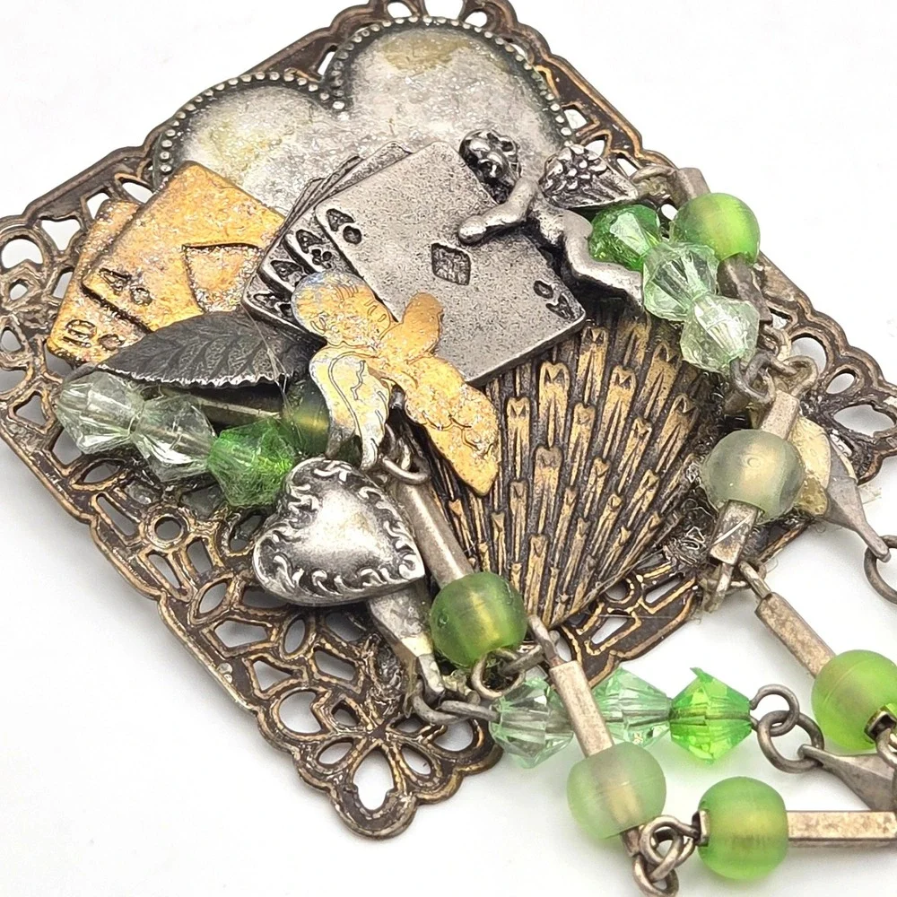 Mixed Metal Assemblage Brooch Cherub Heart Playing Cards Green Glass Bead Dangle